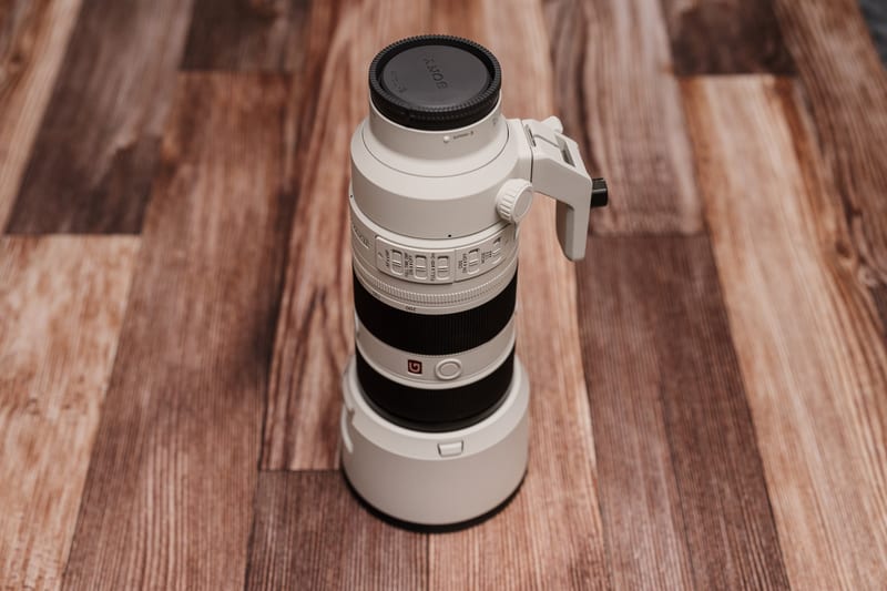 The Sony 70-200mm GM II telephoto zoom with lens hood and removable tripod foot.