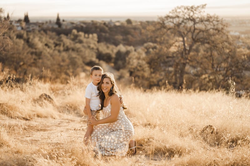 Lavenda family laughing together, golden-hour field